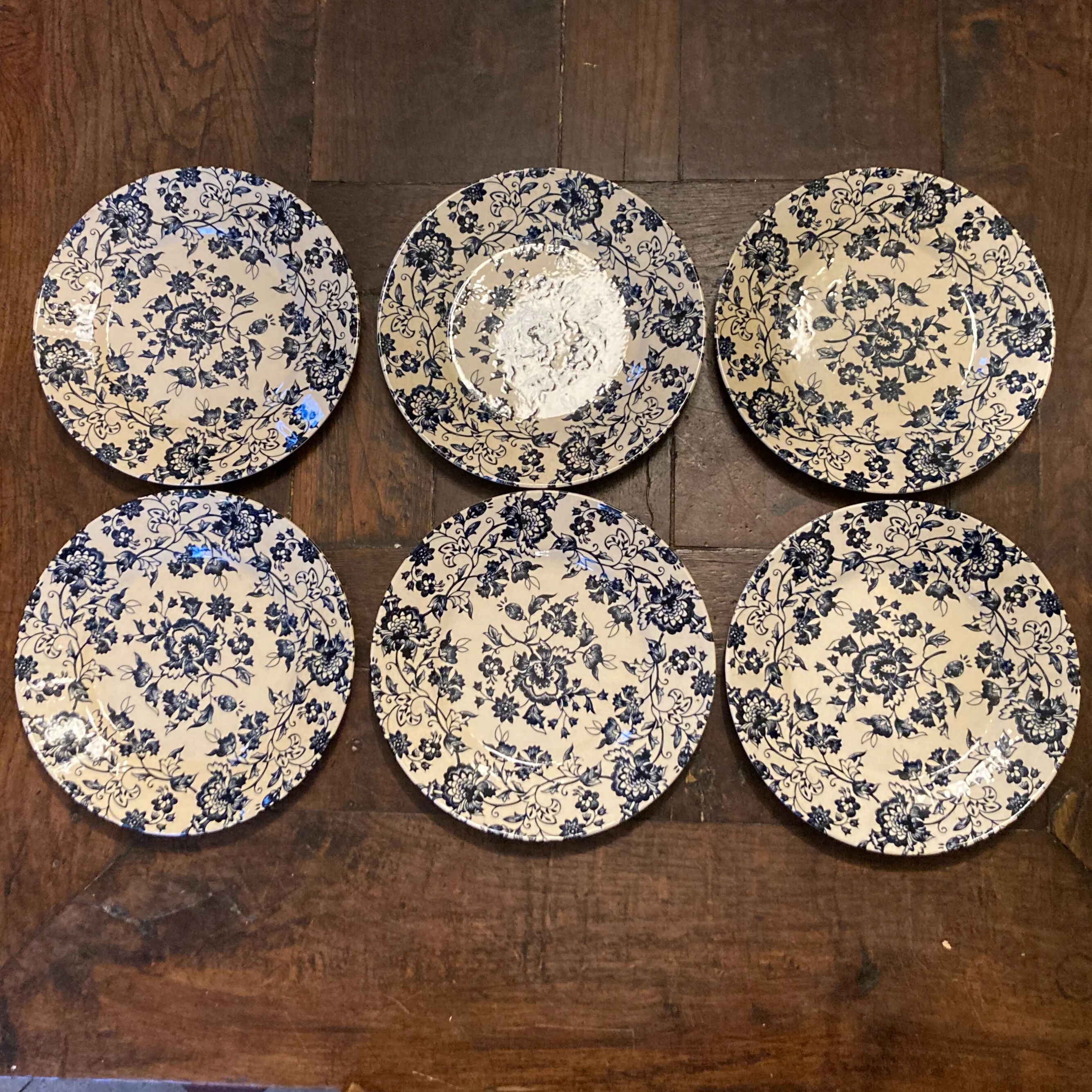 6 antique flat plates in earthenware with blue flower decoration.