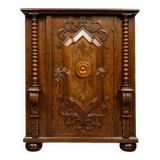 Ornamental piece of solid wood furniture, richly carved, dating from the 17th century.