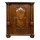 Ornamental piece of solid wood furniture, richly carved, dating from the 17th century.