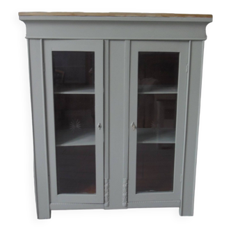 Vintage display cabinet sublimated in verdigris waxed finish, 2 doors with beveled and cut windows.