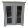 Vintage display cabinet sublimated in verdigris waxed finish, 2 doors with beveled and cut windows.
