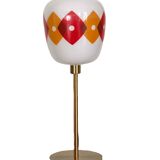 Table lamp with a vintage orange and red "Jacquard" globe in white glass and a golden base