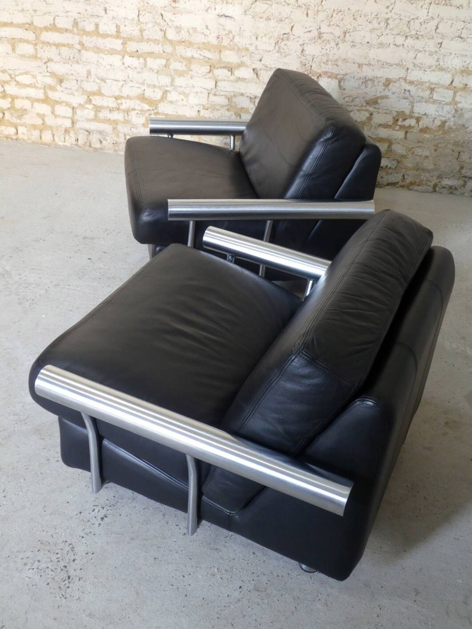 pair of armchairs, black leather & stainless steel, 1990