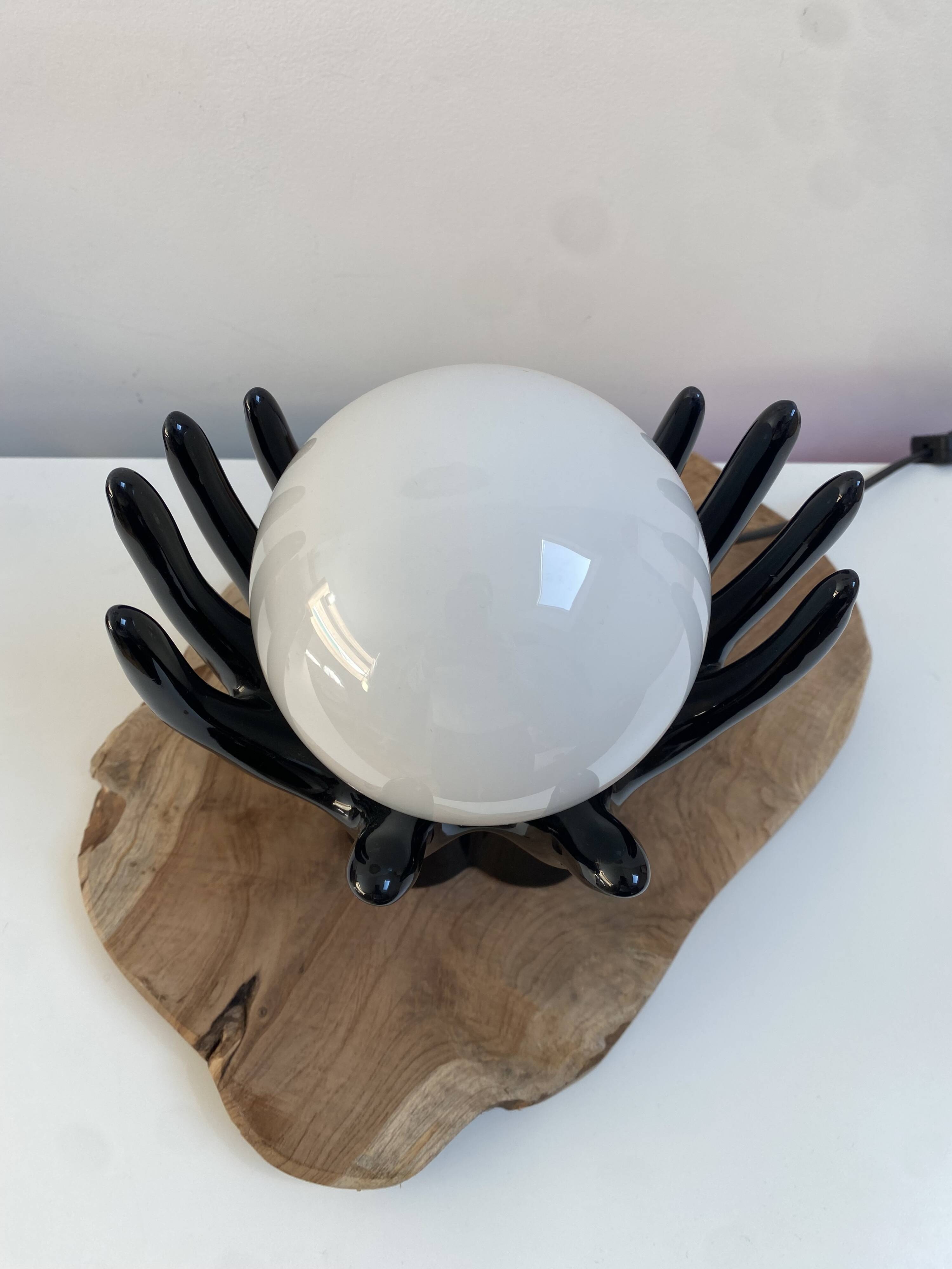 Sculpted ceramic globe lamp.