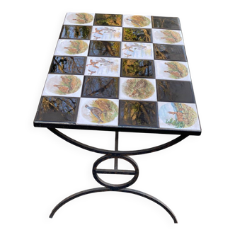 Vintage coffee table with black wrought iron and white tiles.