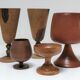Five vintage turned wooden walking glasses