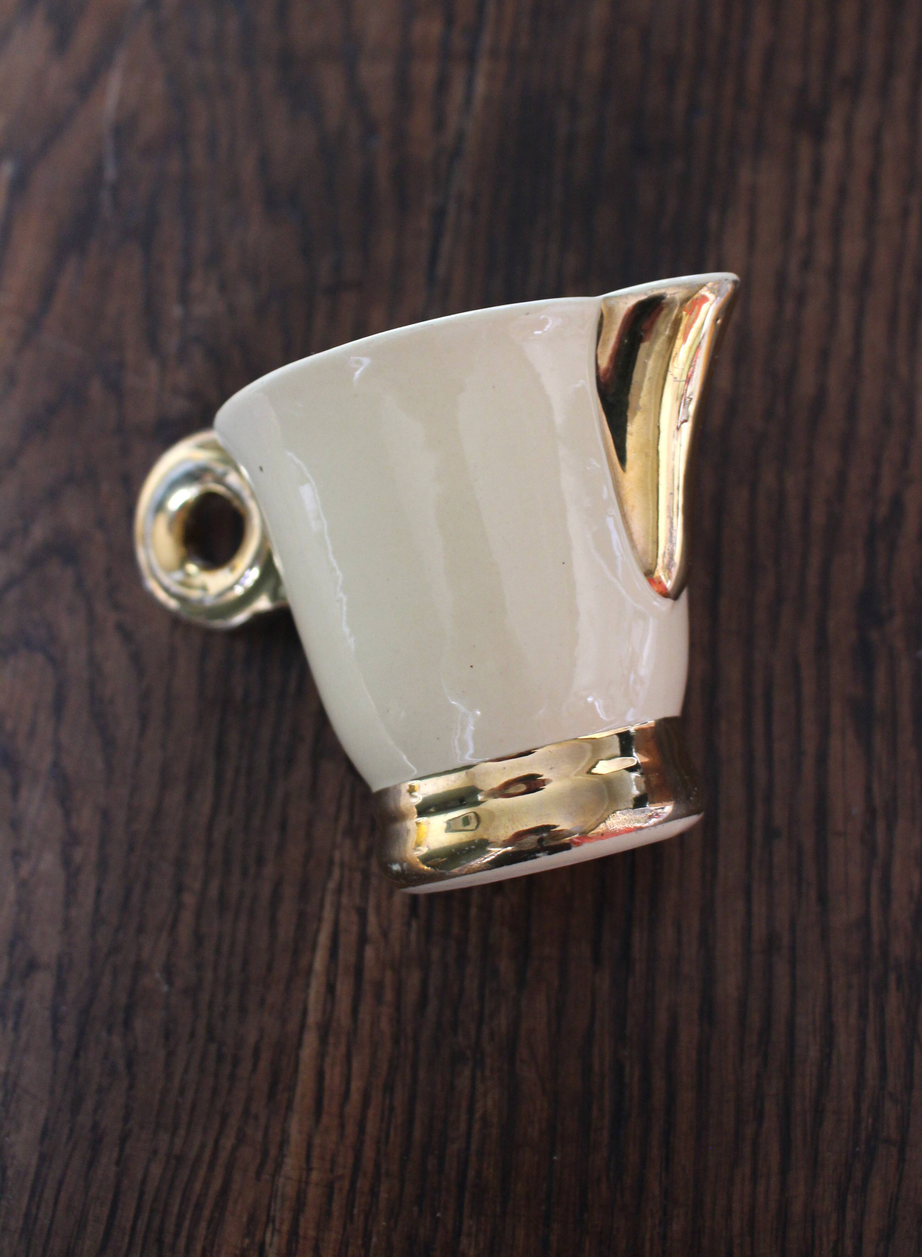 Ecru ceramic milk jug with gold decoration from Sarreguemines.