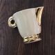 Ecru ceramic milk jug with gold decoration from Sarreguemines.