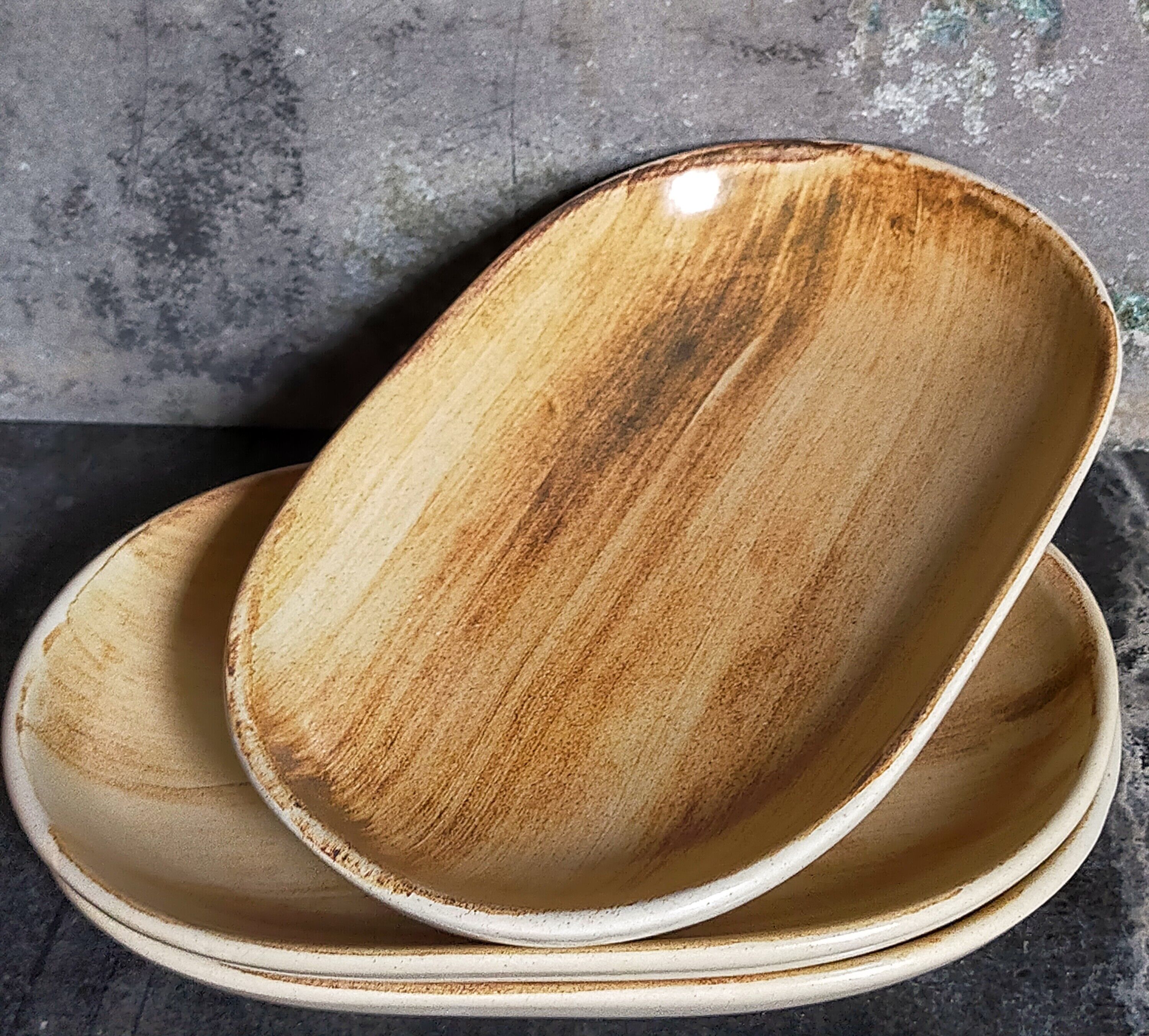 Three ceramic raviers decorated with vintage brushstrokes