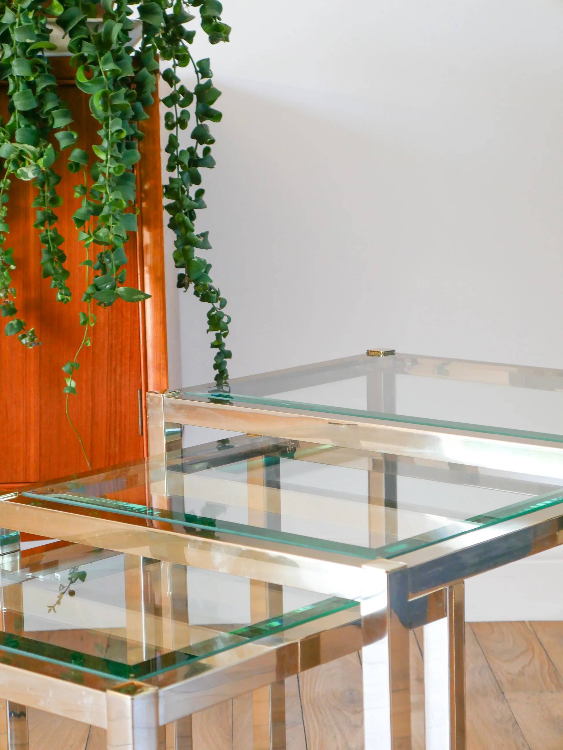 Set of three nesting coffee tables, gilt brass with beveled glass tops, 1980
