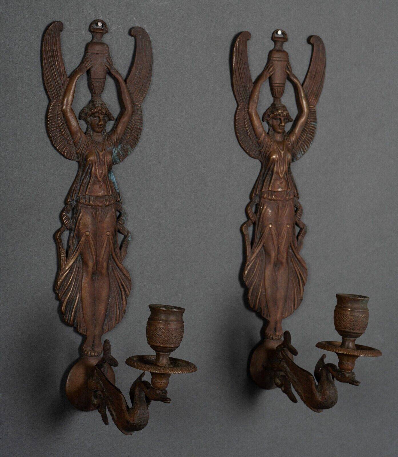 Pair of Empire period bronze sconces decorated with a winged woman
