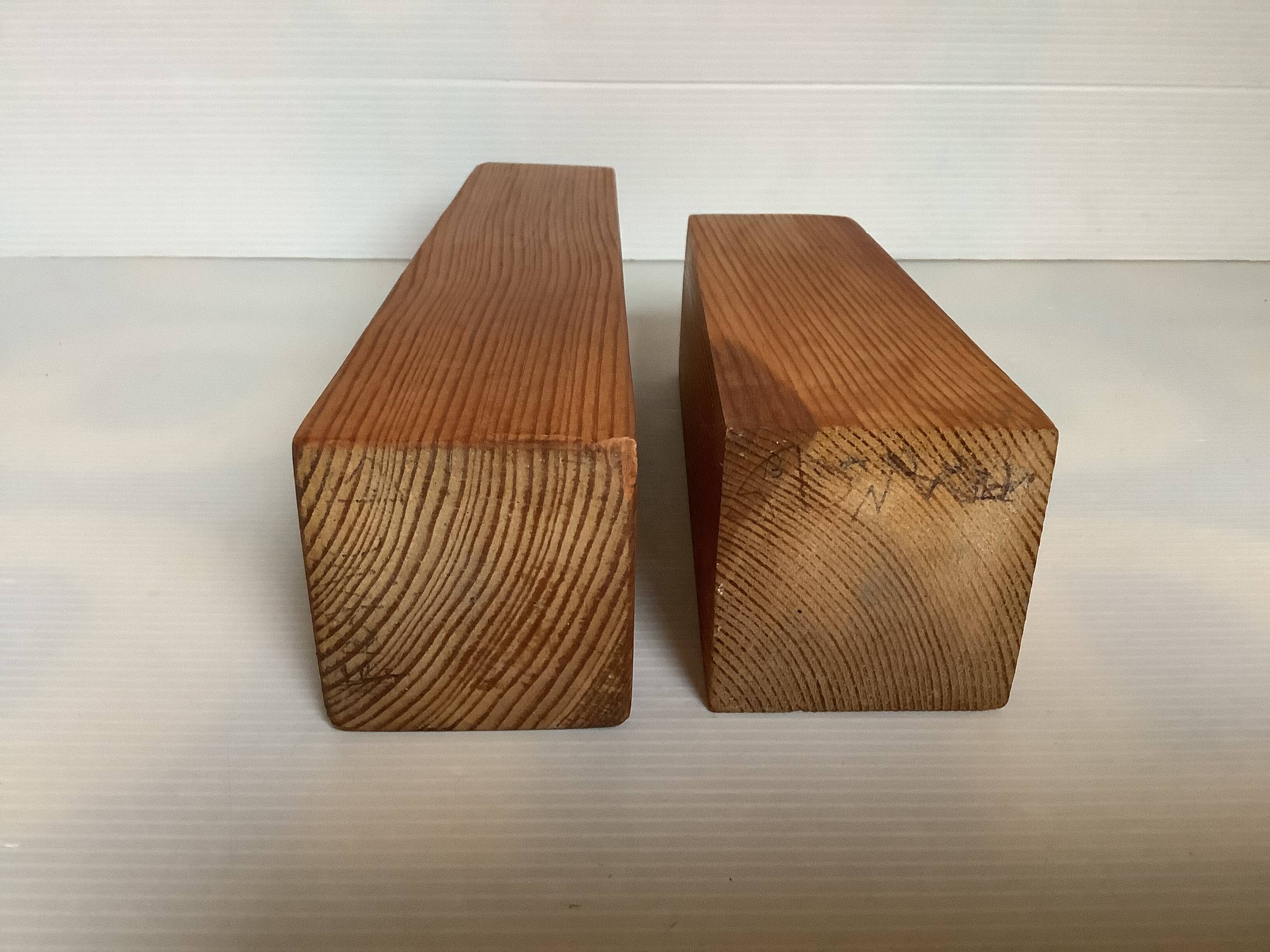 Pair of asymmetrical Scandinavian wooden candlesticks