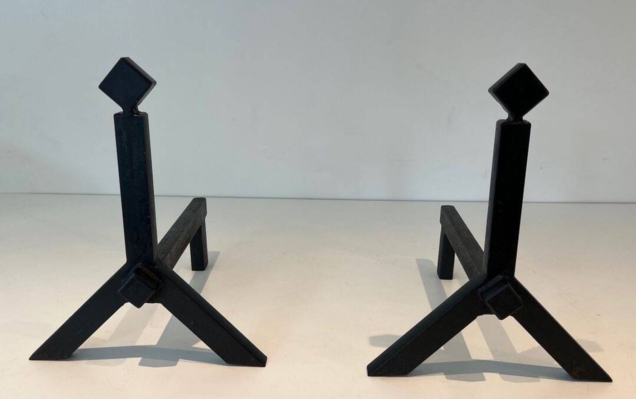 Pair of Modernist Black Iron Andirons with Diamond Finials and Angled Bases