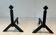 Pair of Modernist Black Iron Andirons with Diamond Finials and Angled Bases