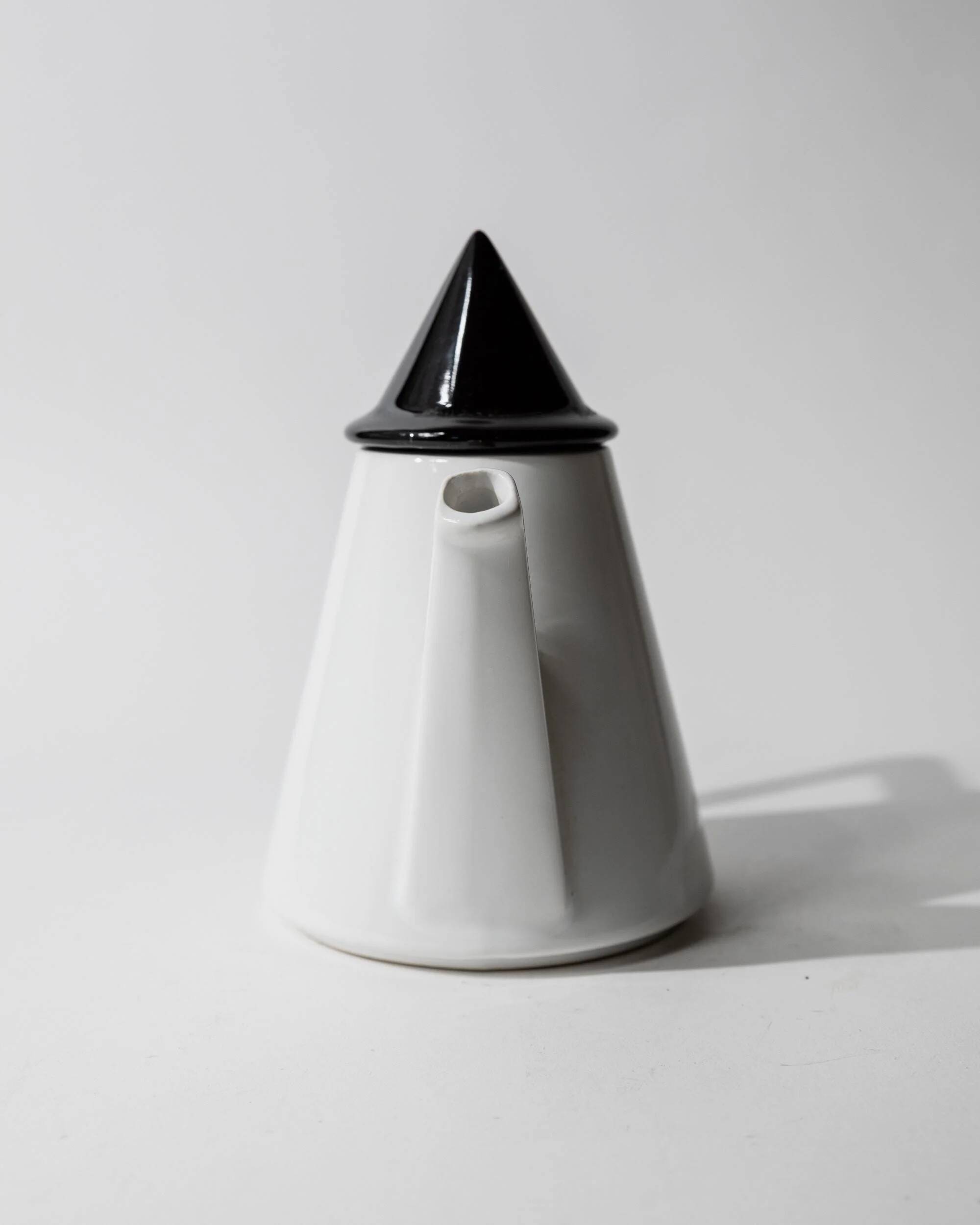 Vintage ceramic coffee pot or teapot from the 1980s, postmodern Memphis design, black and white triangles.