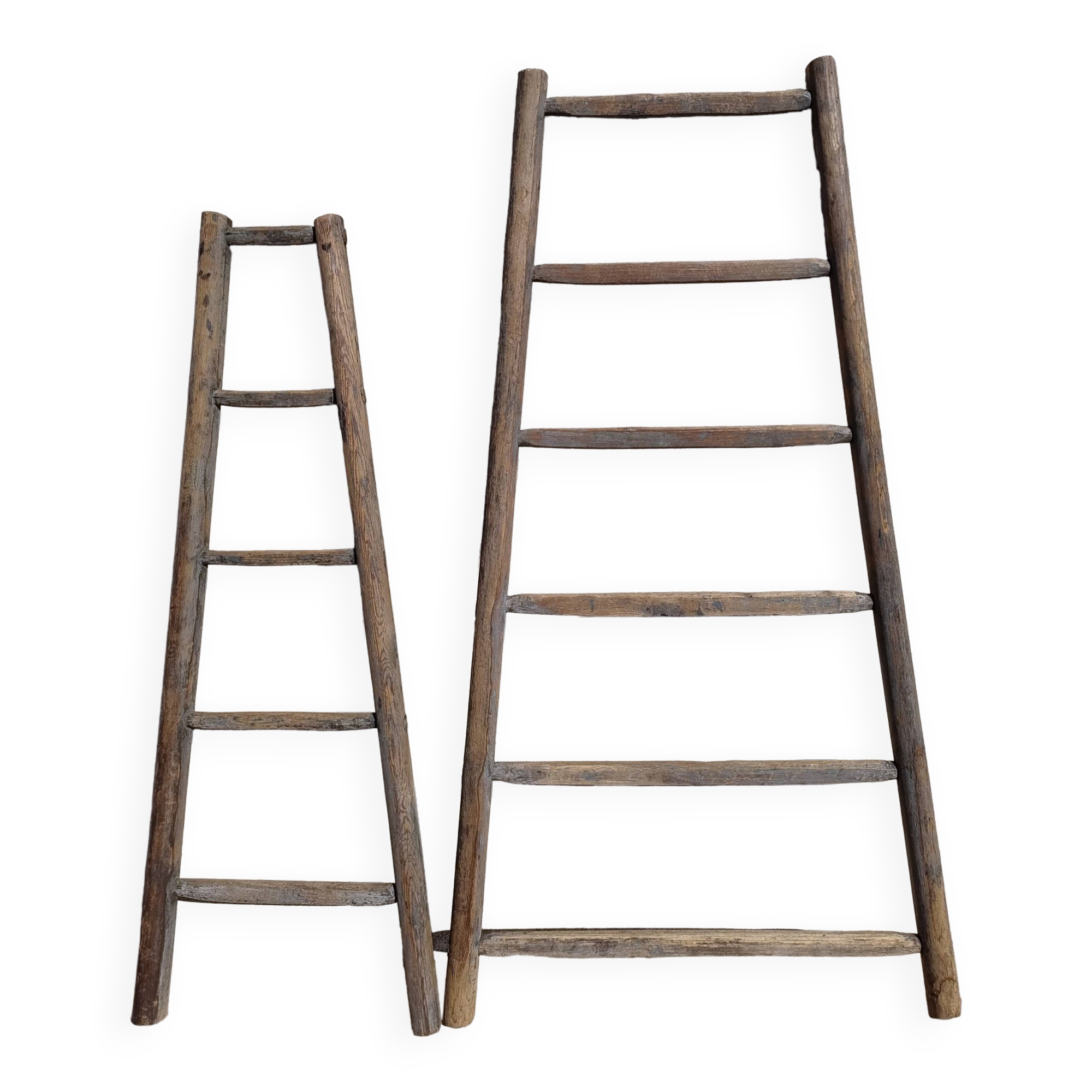 Two weathered wooden ladders H.135 cm