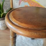 Old farm stool, wooden tripod campaign