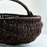 Dark wicker basket, mushroom basket.