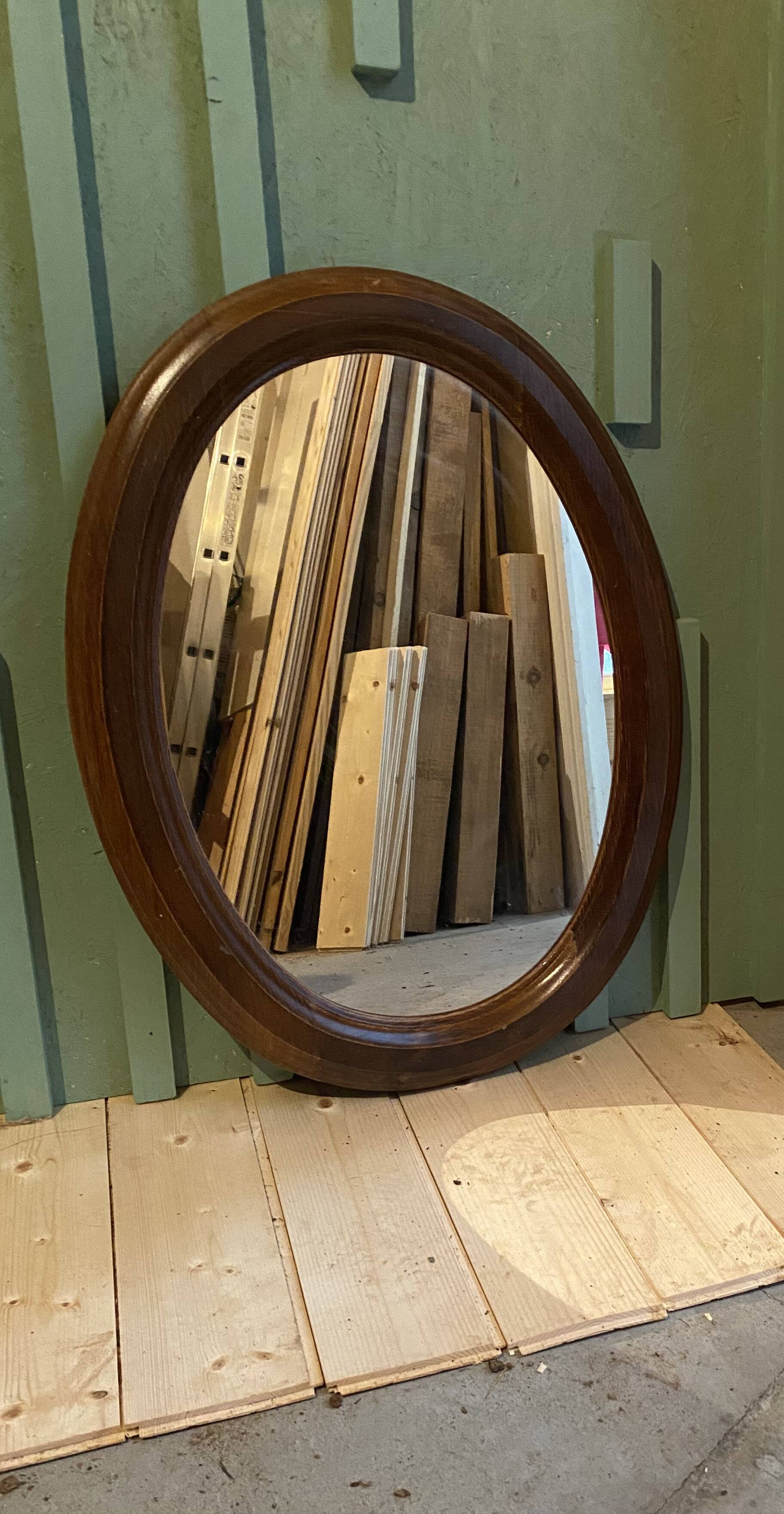 Oval wooden mirror