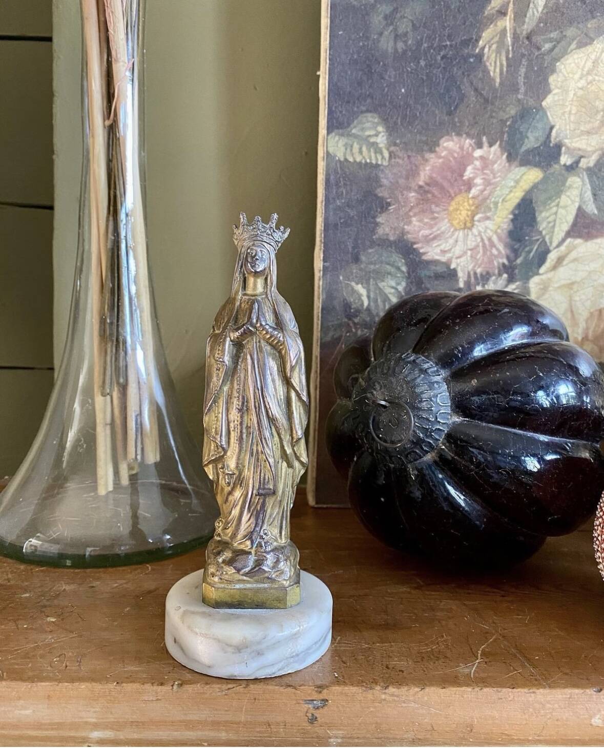 Virgin Mary crowned in metal and brass