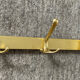 Vintage coat rack in gilded aluminum