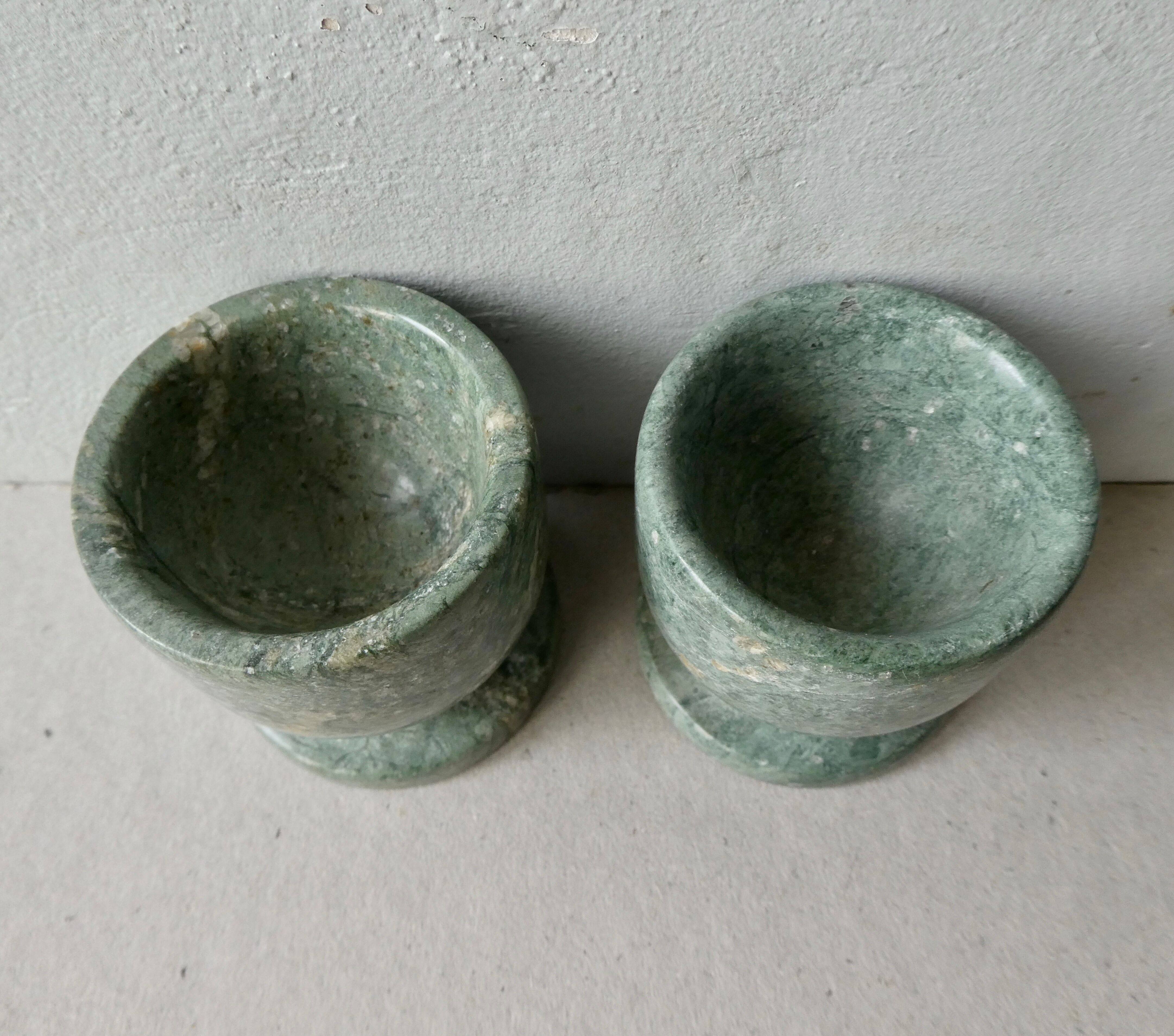 Pair of green marble cockroaches