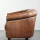 Vintage sheepskin club armchair in English style with deep colours