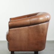 Vintage sheepskin club armchair in English style with deep colours
