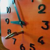 Vintage wall clock from the 50s in red formca