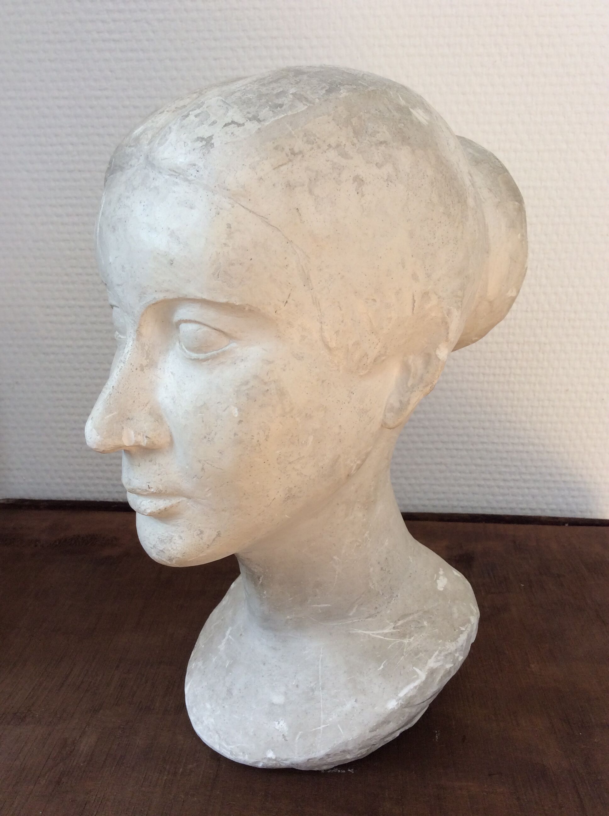 Plaster young woman at the bun