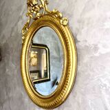 Antique oval mirror from the 20th century