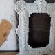 Small old frame in repelled brass patinated white