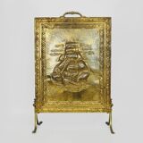 Fireplace screen in repoussé brass with a sailing boat. 1960s.