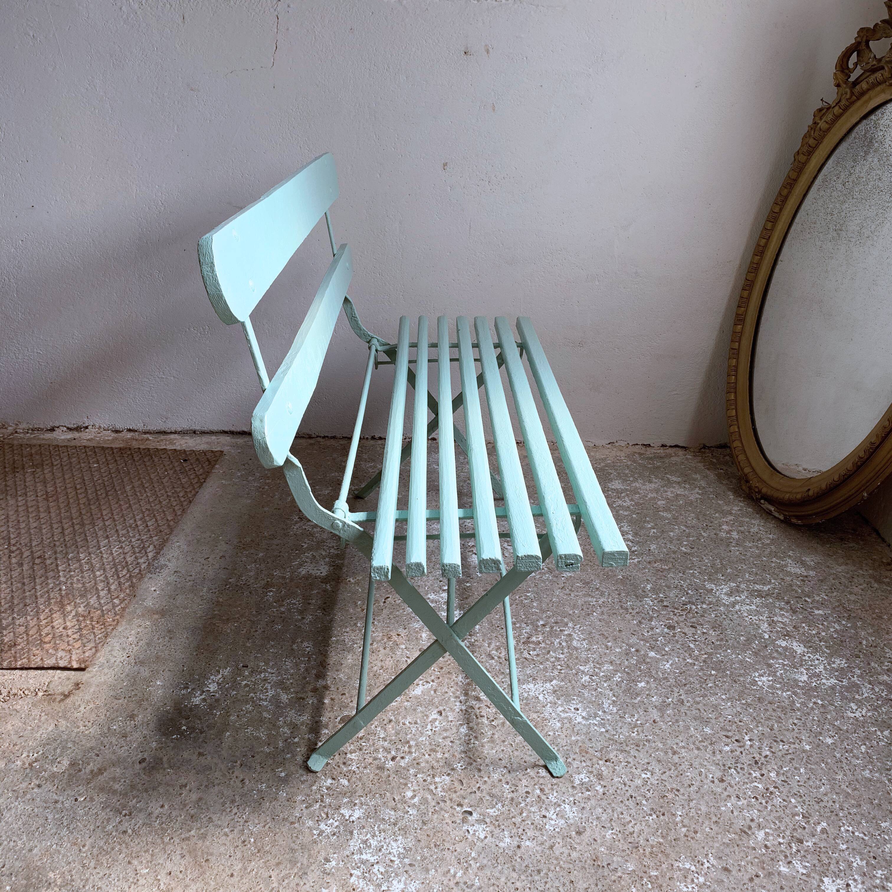 Former folding garden bench with wooden and metal slats