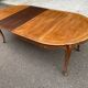 Round extendable dining table Louis XV in solid wood from the 1960s.
