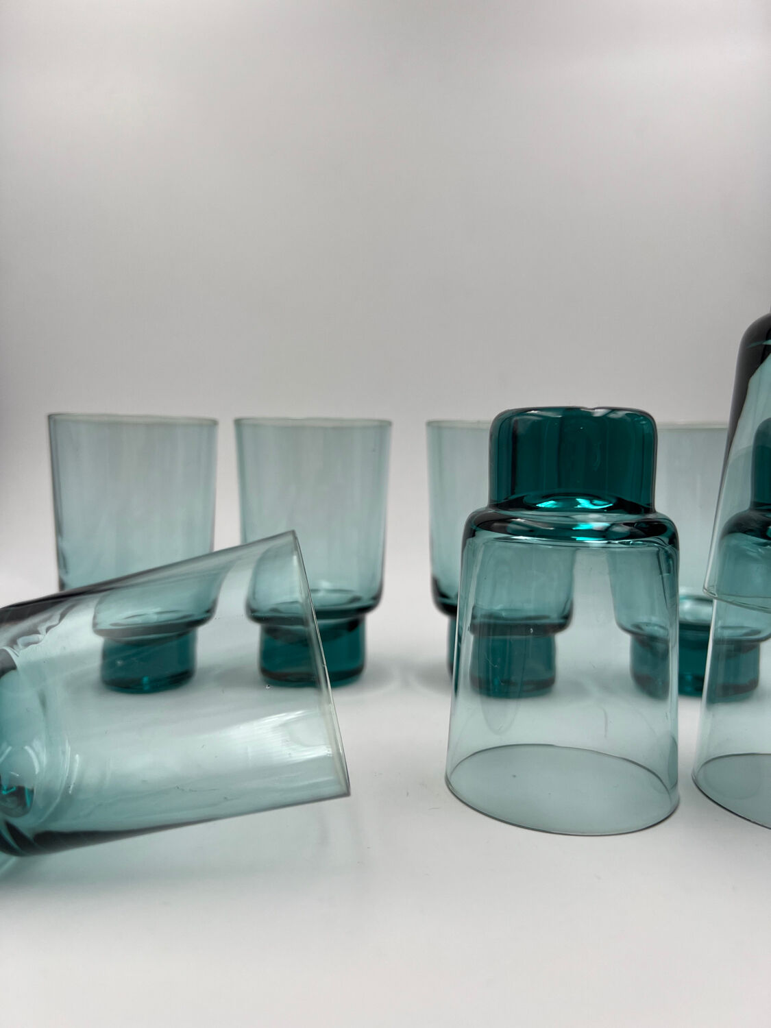 Eight bluish glass water glasses