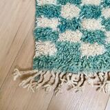 Berber carpet in blue and white checkerboard wool