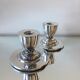 Paire de porte-bougies plaqués en argent art déco
