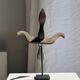 Traditional Indonesian decorative wooden bird on a base, crest model.