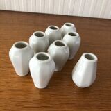 8 miniature vases in white earthenware