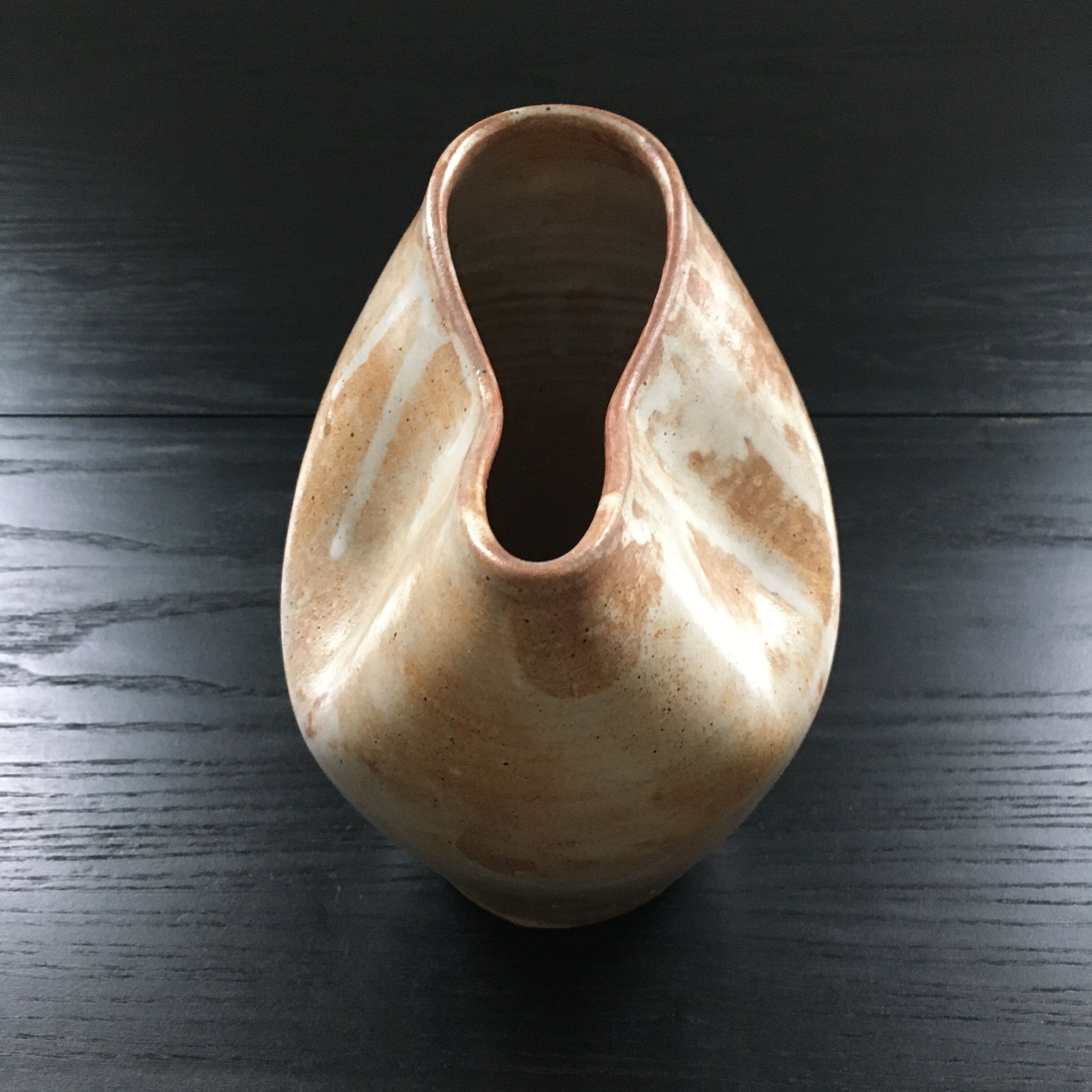 Beige stoneware pitcher with white drips
