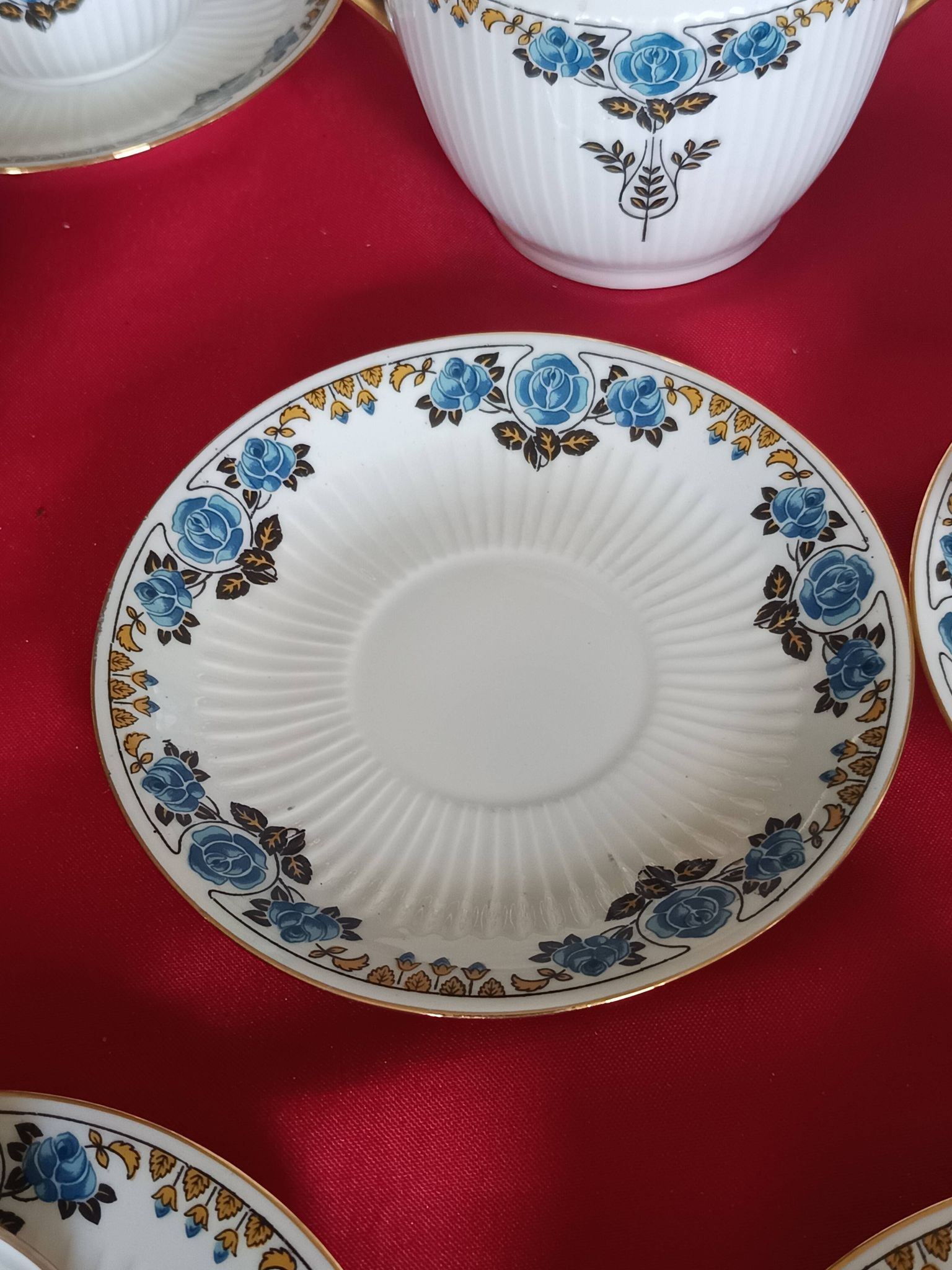 Antique Limoges porcelain coffee/tea service – 14 pieces with blue rose decoration.
