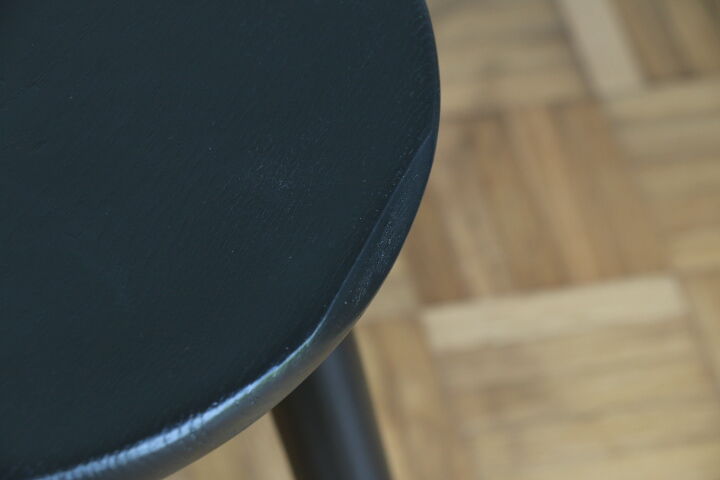 Black tripod wooden stool