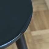 Black tripod wooden stool