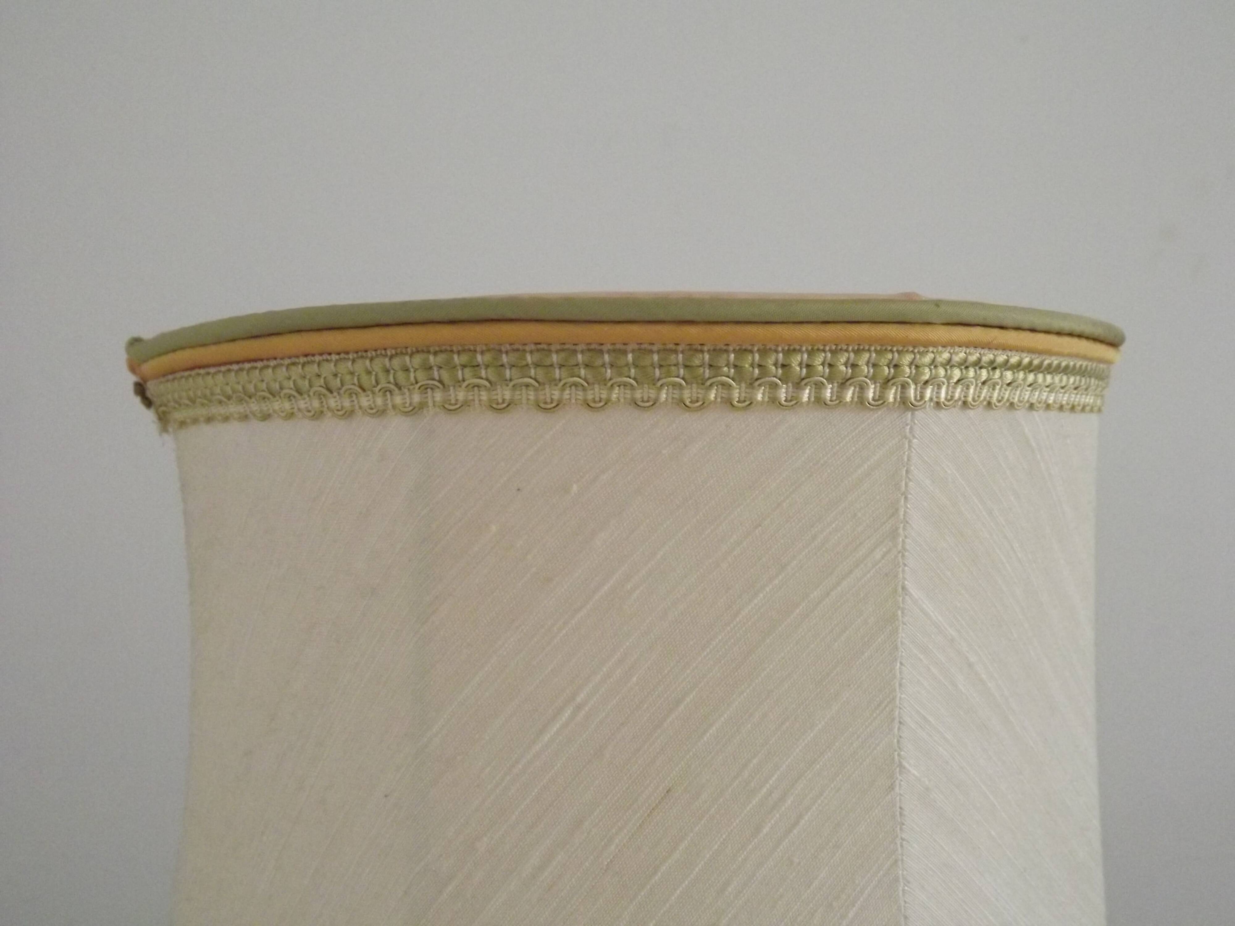 Table lamp with wooden base and fringed shade