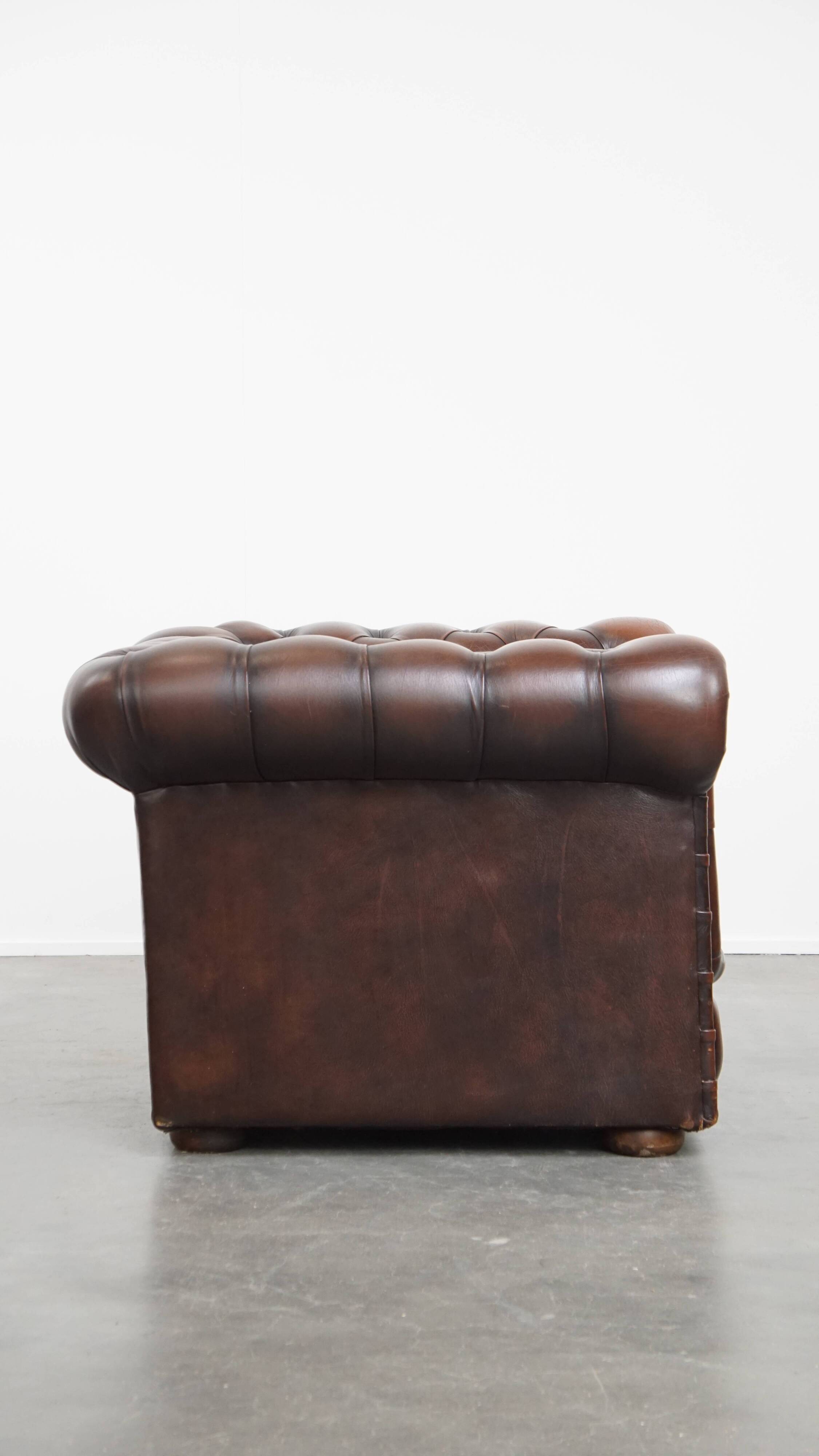 Dark brown English cowhide leather chesterfield armchair