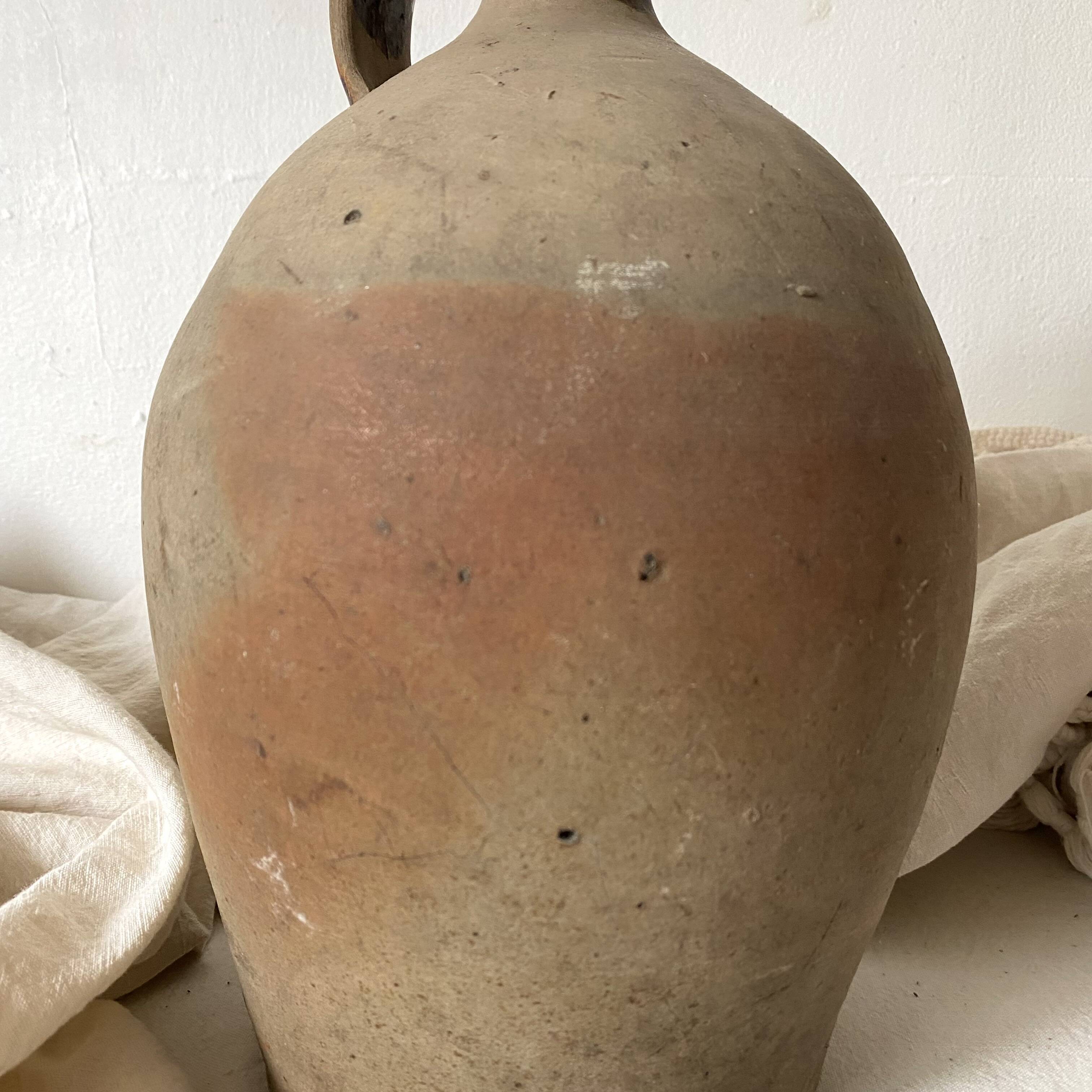 Antique jug, terracotta jar
