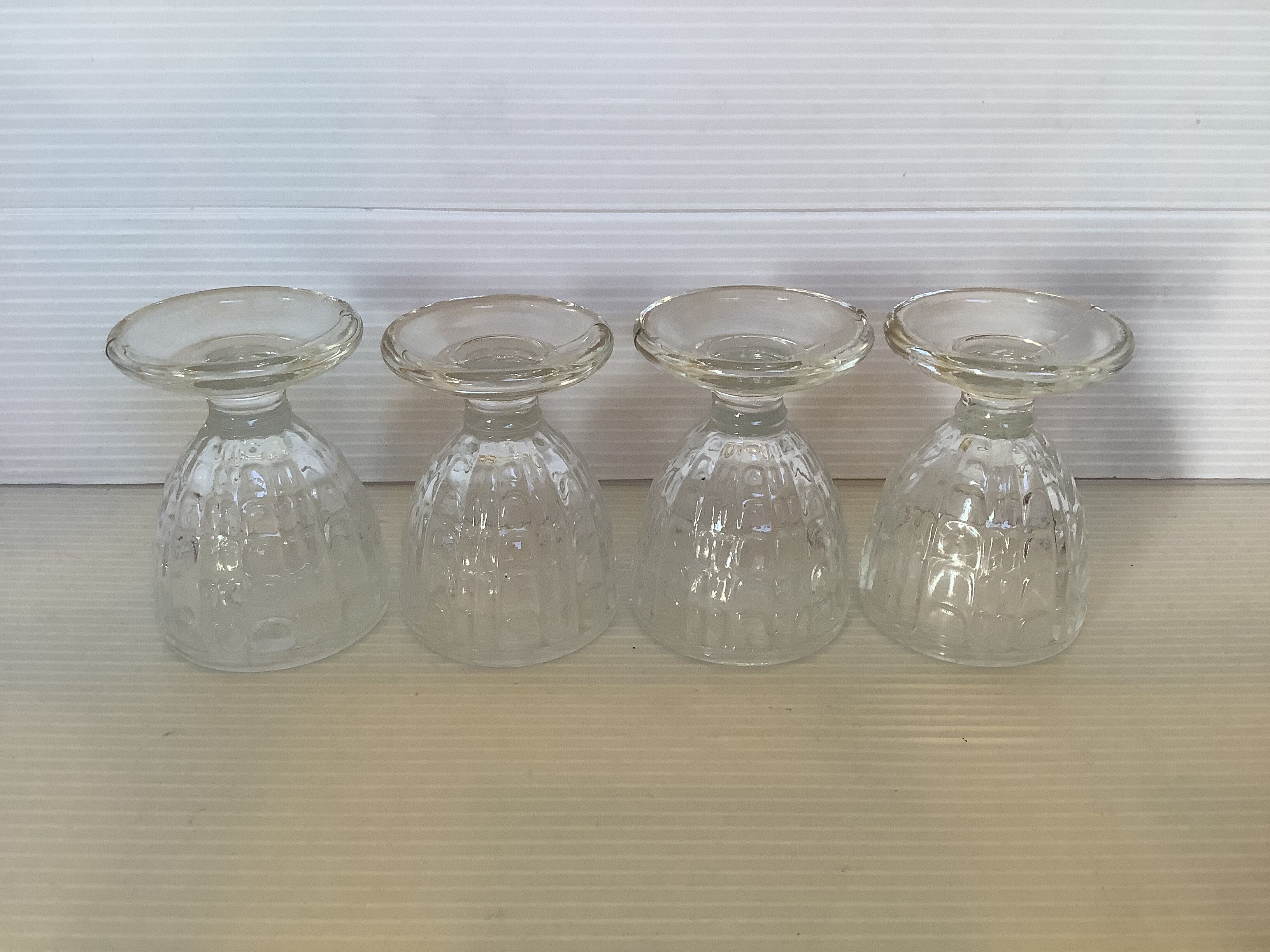 Four old molded glass shells