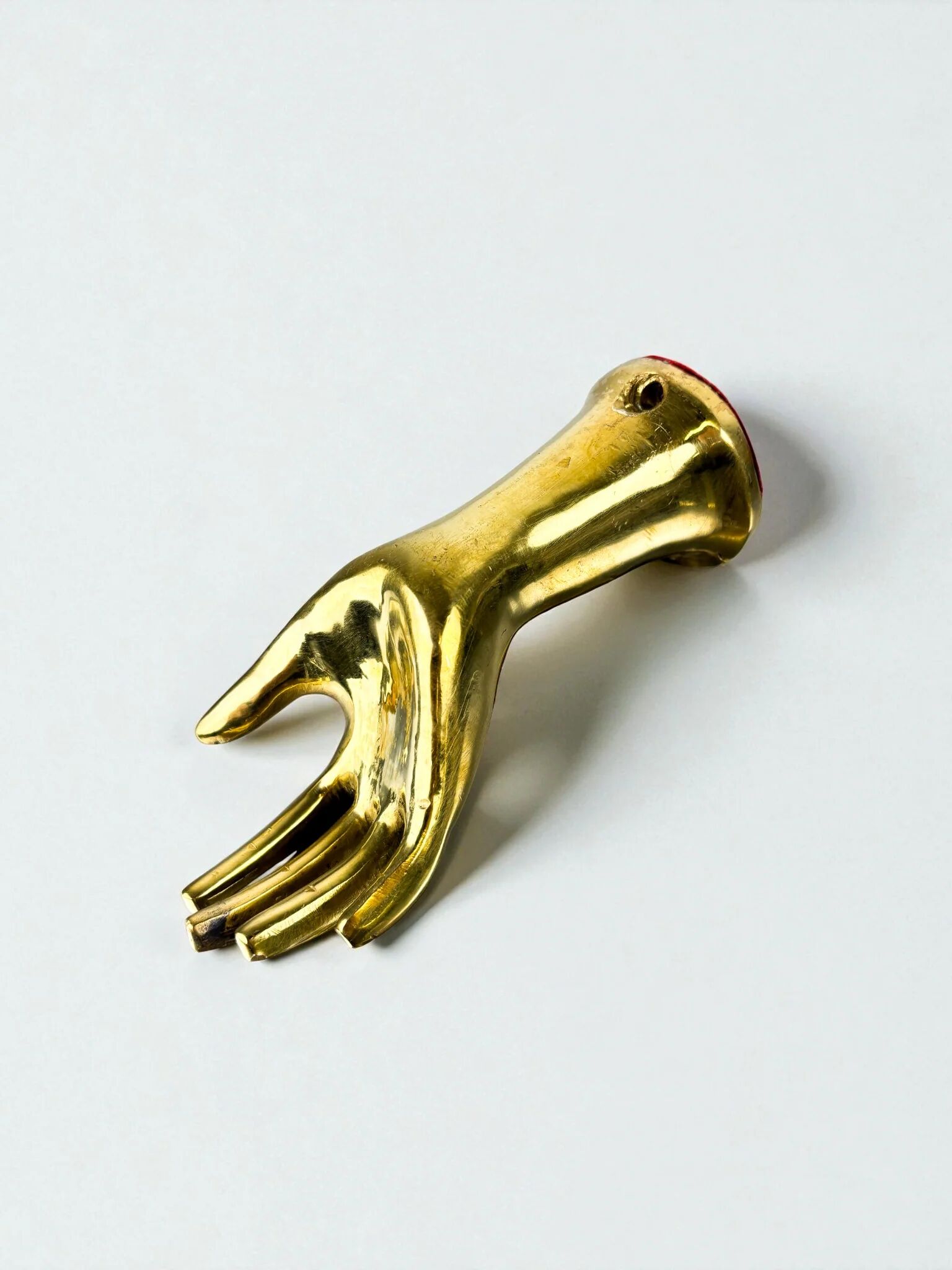 Bronze hand-shaped wall hook, gilded finish, Italy, 1970s