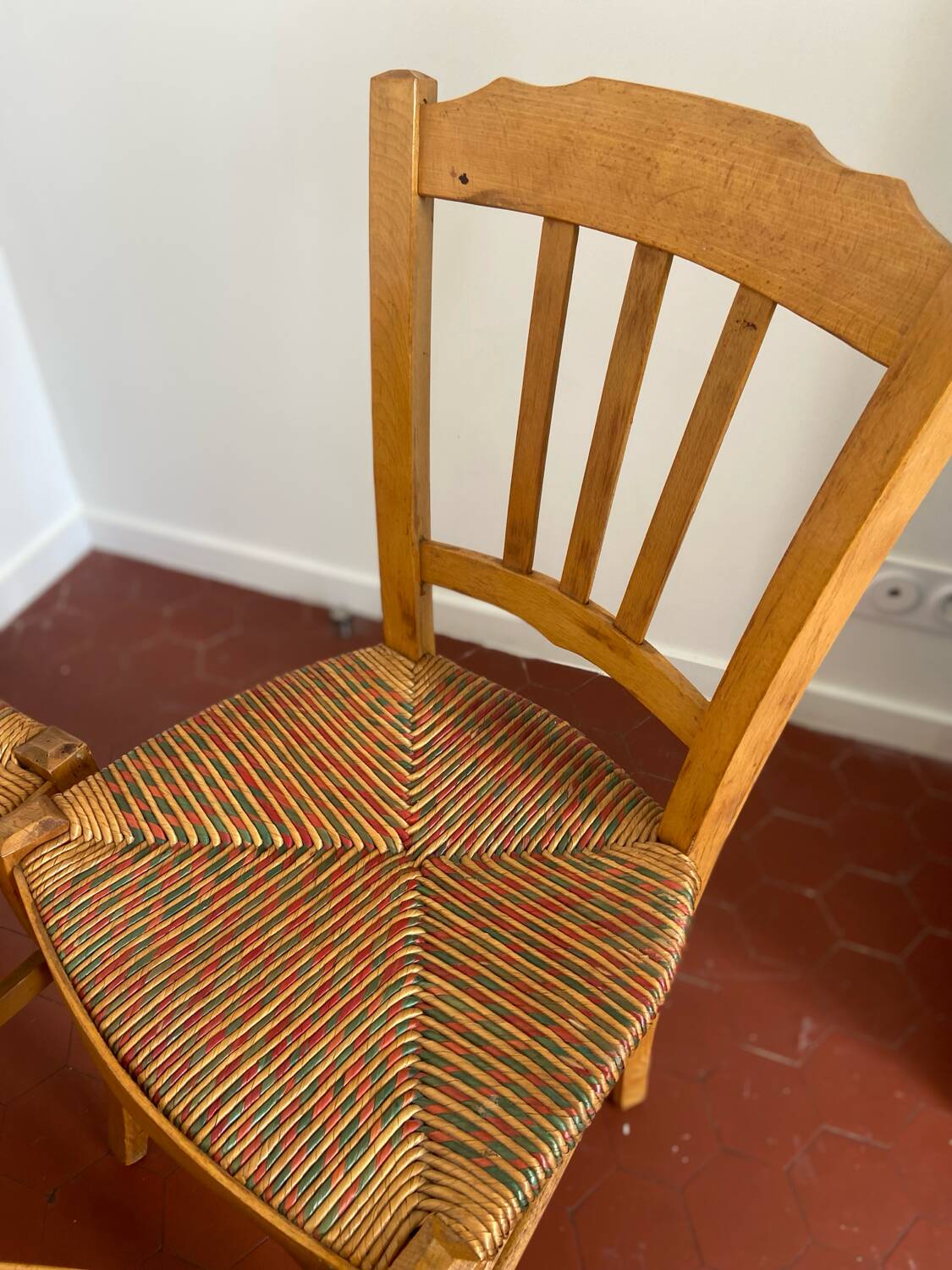 Trio of vintage straw/colored chairs